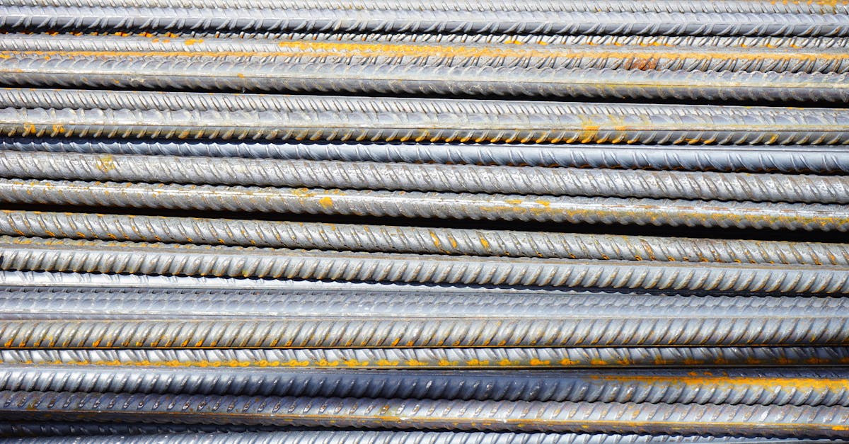 Close-up of stacked rusty steel reinforcing bars used in construction.